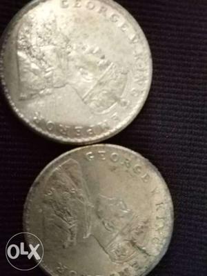 Two Round Silver-colored George King Emperor Coins