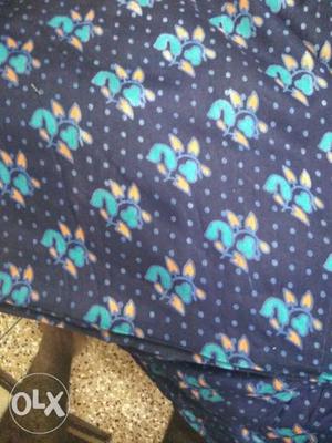 Black, Green, And Blue Floral Textile