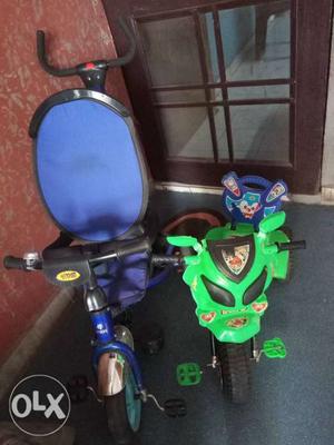Toddler's Two Blue And Green Pedal Trikes