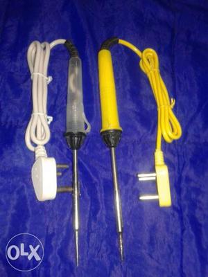Two Gray And Yellow Soldering Irons