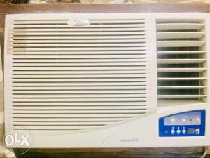 White And Blue Whirlpool Window-type AC Unit