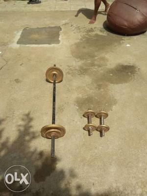 Brown Barbell And Pair Of Dumbbells