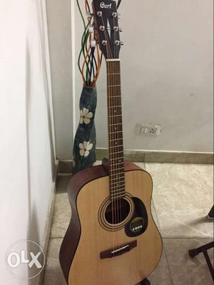 Cort acoustic guitar. 1 month old with bill,cover and stand