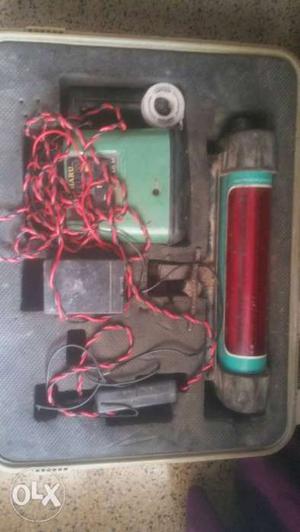 Gray And Red Corded Electric Part