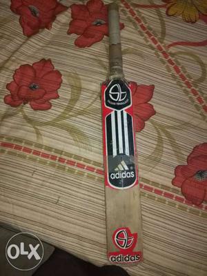 Red, Black, White And Brown Adidas Cricket Bat