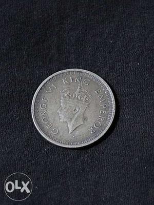 Round Silver-colored Embossed Coin