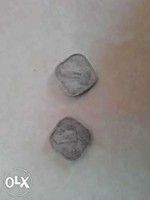 Two Silver-colored Coins On White Surface