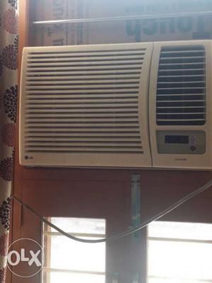 1.5 tan white coloured window AC with remote 3