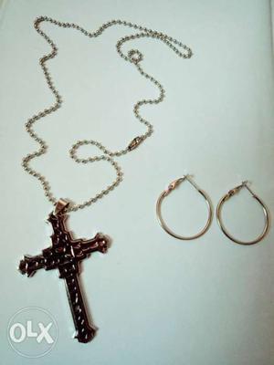 A set of Christian cross necklace and white metal