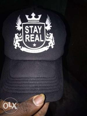 Black And White Baseball Cap With Embroidered Stay Real Text