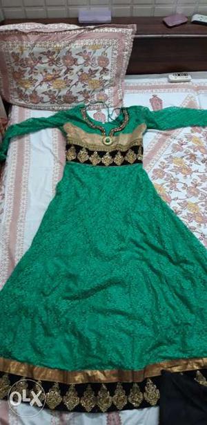 Green anarkali type gown. With pajami n dupatta..