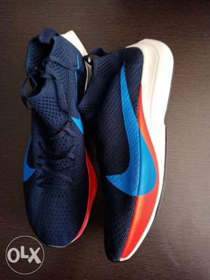 Pair Of Blue Nike Running Shoes
