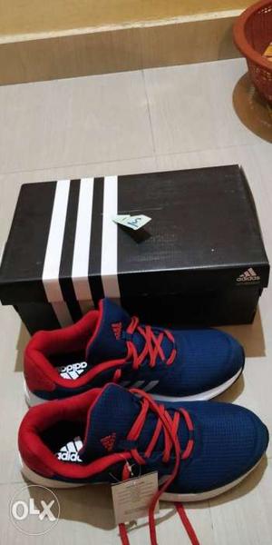 Pair Of Blue-and-red Adidas Shoes
