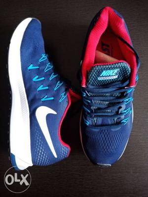 Pair Of Blue-and-red Nike Running Shoes