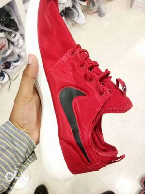 Pair Of Red Nike Low-top Sneakers