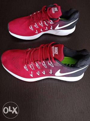 Pair Of Red-and-white Nike Running Shoes