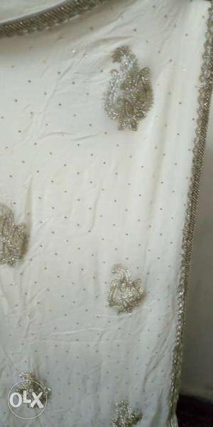 Pure Georgette sarree with heavy embroidery cream Brand new