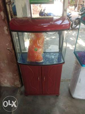 Red Framed Fish Tank With Red Cabinet Base