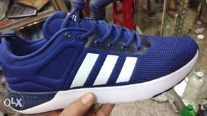 Unpaired Blue And White Adidas Low-top Running Shoe