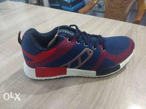 Unpaired Red And Blue Adidas Running Shoe