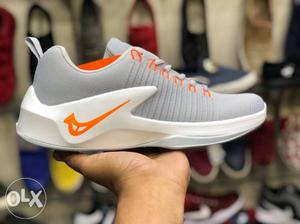 Unpaired White And Gray Nike Running Shoe