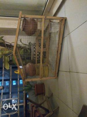 Bird cage made of wood.