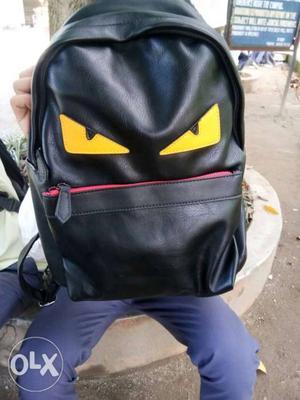 Black And Yellow Cartoon Character Backpack