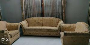Brown Wooden Framed Beige Padded Couch