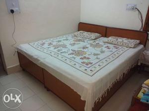 Double bed made of seesham with 2 mattress.