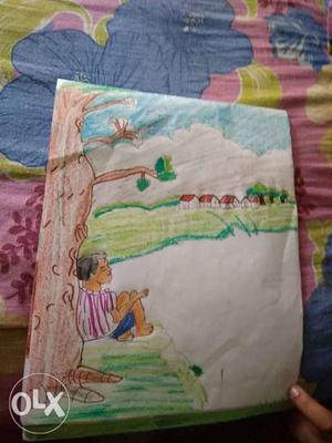 Drawing of a boy sitting under a tree