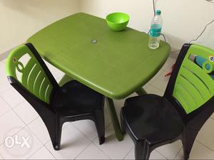 Green And Black Table With Chairs. Company: Supreme