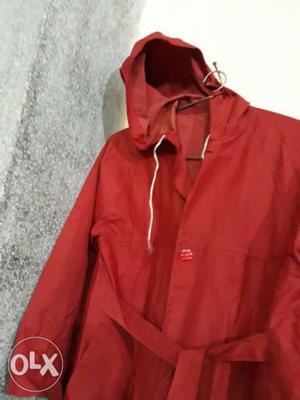 Red rain coat with cap for child of about 6 to 15 year old