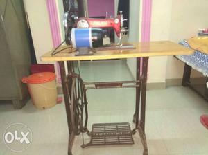 Sewing machine with solid body n motor