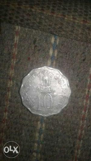 Silver-colored 10 Indian Paise Coin