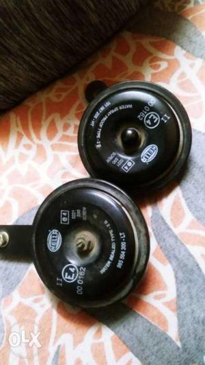 Two Black Weight Plates With Barbell