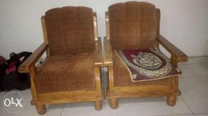 Two Brown Wood Framed Sofa Chairs