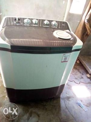 White And Black Clothes Washer