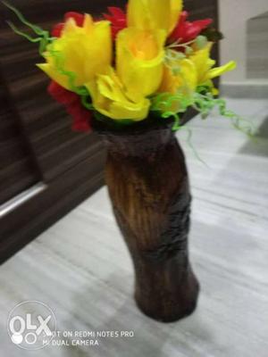 Wooden flower pot with flowers
