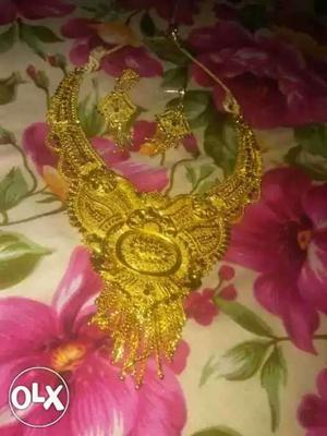 Gold-colored Chandbali Necklace And Pair Of Earrings