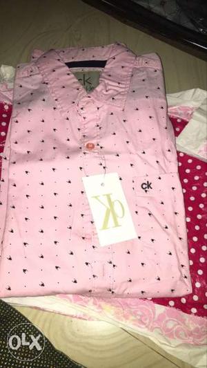Its a brand new ck branded shirt and size L40