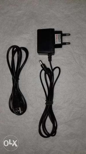 Nokia mobile charger and a USB Data cable.