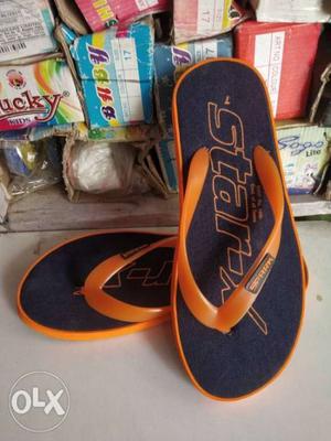 Pair Of Blue-and-orange Nike Flip Flops