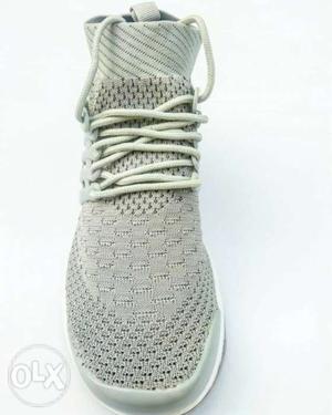 Pair of sneakers in light grey colour
