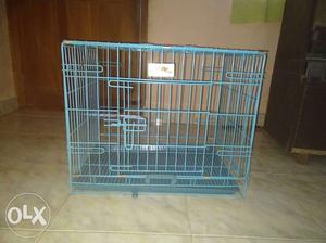 Pet cage with front and top door and a bottom