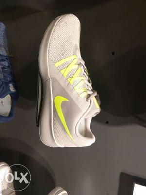 Unpaired Gray And Green Nike Low-top Sneaker
