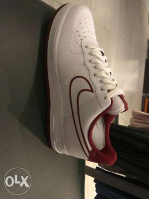 Unpaired White And Red Nike Low-top Sneaker