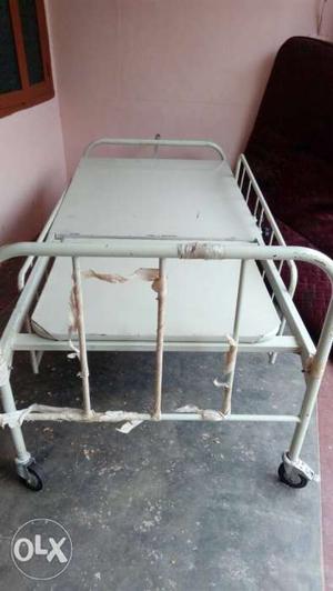 Almost new hospital type rolling cot for sale.
