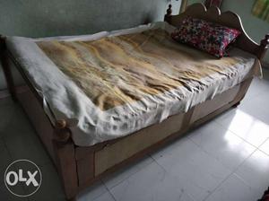 Brown Wooden Bed Frame With White Bed Mattress