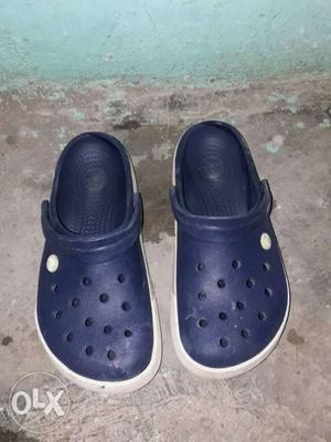 Pair Of Blue-and-white Crocs Sandals