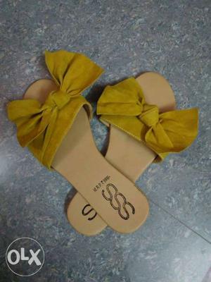 Pair Of Yellow Slide Sandals